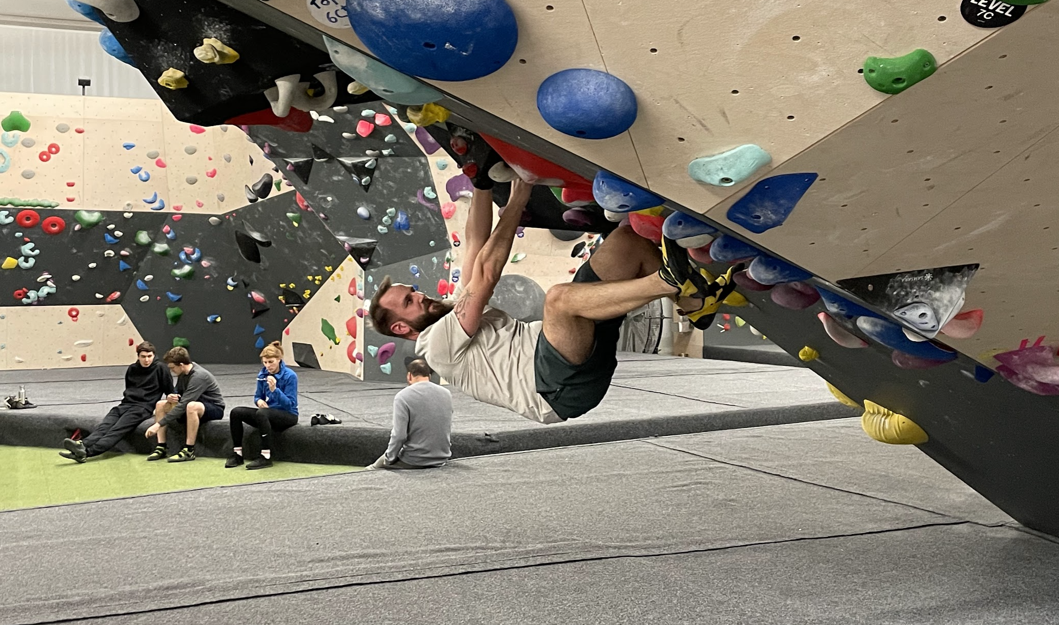 Climber climbing a Boulder wall